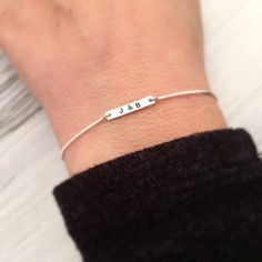 "Tiny Personalized Bracelet - Mini Initial Bracelet - Custom Letter Jewelry - Dainty Silver Bracelet - Valentines Day Gift for her - Birthday This tiny, delicate sterling silver slide bracelet can be personalized with initials or a short name or word (up to 6 characters ONLY, including spaces). The tiny sterling silver tag measures approximately 14 x 3mm , and the box chain is 1mm. These bracelets are fully adjustable with the slide bead making it easy to achieve the perfect fit up to 7 1/2\". T Dainty Silver Bracelet, Initial Bracelet Silver, Bracelet Valentines, 6 Characters, Bead Making, Slide Bracelet, Bracelet Initial, Letter Jewelry, Bracelet Minimalist