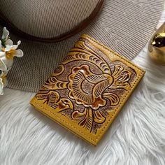 Indulge in the charm of artisanal craftsmanship with our exquisite collection of leather wallets for women!  Each piece is meticulously crafted, exuding elegance and individuality. All our  leather wallets for women are handcrafted one at a time  We ship worldwide from Hawai'i USA  IMPORTANT: If your heart is set on a specific color get it while supplies lasts!  Because all our women wallets are handmade with sustainable leather, we do not have any specific dates to re-stock any item. * 3 Credit Card Slots,  * 1 Bill compartment  * ID window  * Labor Time: 6 Hours * 3.5" x 4" ( 9 x 10 cm)  * Sustainable goat leather  WHATS OUR STORY?  Our team of artisans have a passion for working with leather that has been passed down through generations. We take pride in creating beautiful and sustainab Leather Wallets For Women, Sustainable Leather, Personalized Gifts For Her, Leather Wallets, Goat Leather, Women Leather, Small Wallet, Embossed Leather, Wallets For Women