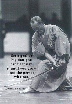 a man kneeling down with a stick in his hand and a quote on the side