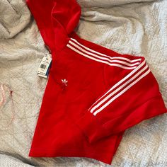 Red Adidas Short Hoodie (Crop) Size 1x Nwt Sporty Red Hoodie For Spring, Red Drawstring Hood Top In Athleisure Style, Red Adidas Tops For Winter, Red Hooded Sweatshirt For Spring, Adidas Red Winter Tops, Red Athleisure Top With Drawstring Hood, Sporty Red Hooded Top, Adidas Red Sweatshirt For Winter, Red Adidas Sweatshirt For Winter