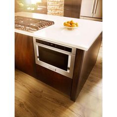 a kitchen with an oven, stove and counter top in it's center island