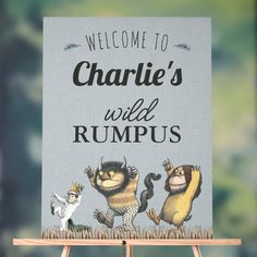 a welcome sign to charlie's wild rumpls with three cartoon characters on it