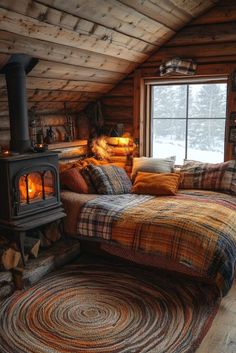 a bed in a room with a wood stove and rugs on the floor next to it