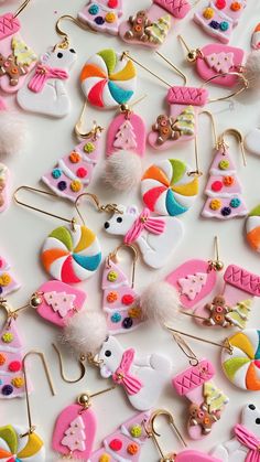 many different types of earrings on a white surface