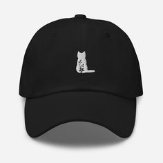 a black hat with a white cat on it