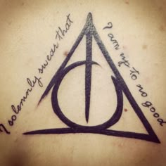 a harry potter tattoo on the back of a woman