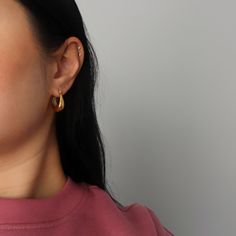 Perfect chunky hoops for an effortless on the go look. Lightweight so it's perfect for on the go, you won't be able to tell you're wearing them! Tapered at the top and wider at the bottom. -stainless steel, gold plated Trendy Chunky Gold Earrings, Chunky Metal Hoop Earrings For Everyday, Everyday Chunky Metal Hoop Earrings, Trendy Chunky Gold Hoop Earrings, Gold Chunky Hoop Earrings Trendy Style, Trendy Gold Chunky Hoop Earrings, Everyday Minimalist Chunky Earrings, Modern Chunky Hoop Earrings For Everyday, Everyday Chunky Hoop Earrings