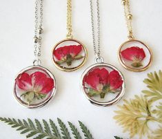 Resin Jewelry, Real Flower Necklace, Red Rose Necklace, Resin Necklace DESCRIPTION A stunning pendant necklace features a real red rose flower encased in a gold or a silver round bezel charm with resin. MATERIAL Choose between silver stainless steel, or sterling silver 925 chain or 18K gold plated stainless steel chain or 18K gold plated over 925 sterling silver chain. 18K solid brass pendant or silver plated over brass pendant. Hypoallergenic, lead & nickel free. MEANING Roses are a symbol Red Rose Jewelry, Resin Jewlery, Mustard Seed Jewelry, Real Flower Necklace, Dried Flower Jewelry, Pressed Flower Necklace, Resin Pendant Necklace, Necklace Resin, Jewelry Real