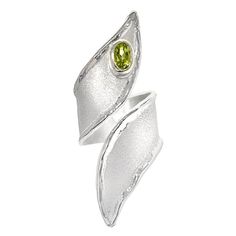 Yianni Creations Ammos Collection 100% Handmade Artisan Ring from Fine Silver featuring 0.50 Carat Peridot complemented by unique techniques of craftsmanship - brushed texture and nature-inspired liquid edges. The core of this beautiful asymmetrical-shaped ring is made from Fine Silver 950 purity, which is plated with Palladium, to protect the ring from the elements. Yianni Creations jewelry ensures both Artistic and Quality satisfaction. This gorgeous ring adjusts in size due to its design, mea Sapphire And Diamond Band, Artisan Rings, Modern Ring, Wide Band Rings, Bling Rings, Diamond Rings Bands, Vintage Band, Wide Bands, Handmade Artisan