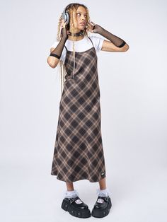 Shop our edit of trending y2k, dark academia, and grunge-inspired fashion staples like our Delia Brown Plaid Maxi Dress in brown with a check plaid pattern. Perfect for layering and ethically made to last. International shipping available. Fall Aesthetic Clothes, Layer Dress Outfit, 1990s Fashion Grunge, Y2k Dark Academia, Plaid Maxi Dress, Dress Layering, Minga London, Fashion Decades, 90s Fashion Grunge