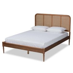 the headboard and foot board are made from rattan, with two pillows on each side