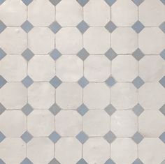 a white and gray tiled floor with small squares