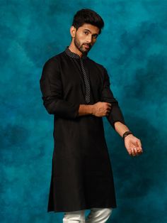 Vastramay Men's Black Cotton Blend Ethnic Kurta The Vastramay Men's Black Cotton Blend Ethnic Kurta is a perfect blend of traditional and modern styles. This kurta is designed to provide both comfort and elegance, making it ideal for various occasions such as festivals, weddings, and casual gatherings. The sleek black color adds a touch of sophistication, while the high-quality cotton blend fabric ensures durability and comfort throughout the day. Key Features Stylish and elegant design Comforta Traditional Black Ceremonial Kurta, Ceremonial Black Fitted Kurta, Formal Black Kurta Fabric, Luxury Men's Black Kurta, Men’s Black Kurta, Collar Pattern, Mandarin Collar, Black Color, Classic Black