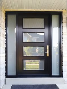 a black front door with two sidelights