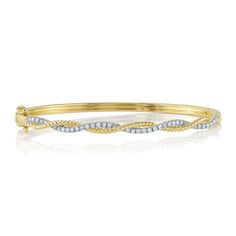 Add shimmer to your wrist with this stunning bangle bracelet from Shy Creation. Crafted in 14k yellow gold, this bangle boasts twisted design with a diamond-adorned row and a cable textured row that twist together. The diamonds are 1/2ctw, H in color, and SI2 in clarity. This bracelet measures 0.15 inches in width. Braided Twist, Infinity Braid, Twisted Bangle, Wedding Day Jewelry, Yellow Gold Bangle, Studded Necklace, Gold Bangle, Gold Bangle Bracelet, Diamond Bangle