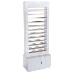 This tall standalone PC02 Nail Polish Rack organization center is the perfect addition to your spa or salon if you're searching for a beautiful and elegant piece. With ample top space for up to 500 nail polish bottles and convenient bottom storage, this Polish Display unit will undoubtedly become the focal point of your spa. This unit is equipped with numerous shelves that allow you to organize your polishes according to brand, color, or other criteria, making it easy to locate them quickly. Add Nail Polish Organization, Nail Salon Chairs, Retail Display Shelves, Nail Polish Display, Polish Organization, Nail Polish Rack, Polish Display, Nail Salon Decor, Nail Polish Storage