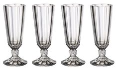 three tall glass vases sitting next to each other