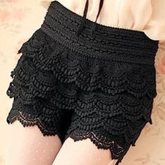 Black Shorts With Layers Of Frothy Crochet-Style Lace Are A Junior Size Small. Elasticized Waistband Is 3' Wide, 13" Waist (Laid Flat), Stretches To 16"; Short Length Measured From Crotch Is 4". Never Worn, But No Tags Inside Or Out. Hand Wash Lukewarm Or Cool Water, Or Machine Wash Gentle Would Be Recommended. Fabric: 100% Polyester. High Waist Elastic Black Shorts, Black High Waist Elastic Shorts, Black Stretch Ruffled Bottoms, Black Elastic Shorts For Summer, Black Ruffled Bottoms For Spring, Black Bottoms With Ruffles For Spring, Fitted Black Bottoms With Ruffles, Black Fitted Bottoms With Ruffles, Black Ruffled Shorts For Summer