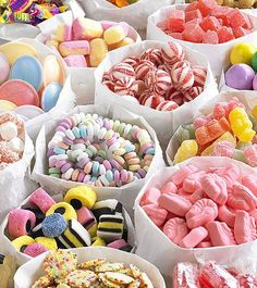 there are many different types of candy in bowls