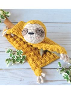 a crocheted stuffed animal with a banana on it's head and arms