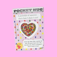 a card with a heart shaped candy on it