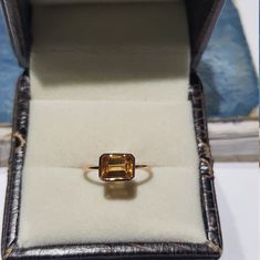 14k solid rose gold natural AAA quality emerald cut rectangular shaped citrine semi precious gemstone ring. 1. The weight of the natural citrine gemstone used in the ring =1.10 cts. 2. The weight of 14k solid rose gold used in the ring =1.130 grms. 3. The design of the ring is very nice and beautiful. 4. I have used all my skills and experience to manufacture this ring as beautiful as I can and I do hope my work will be appreciated. Thanks Yellow Gold Citrine Topaz Ring, Emerald Cut, Elegant Yellow Gold Rectangular Topaz Ring, Faceted Emerald Cut Topaz Ring In Fine Jewelry, Faceted Emerald Cut Topaz Fine Jewelry Ring, Emerald Cut Faceted Topaz Ring In Fine Jewelry Style, Rectangular 14k Gold Emerald Ring As Gift, 14k Gold Rectangular Emerald Ring Gift, Gold Topaz Jewelry With Emerald Cut, Citrine Ring With Rectangular Stone For Gift