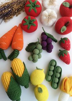 crocheted fruits and vegetables displayed on white surface