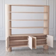 a wooden shelf with two open shelves on top