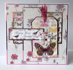 a card with butterflies and flowers on it