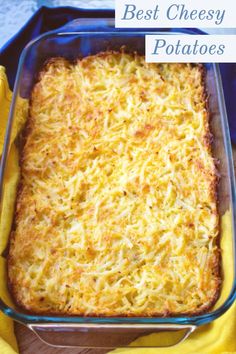 a casserole dish with cheese on top in a blue pan and yellow napkin