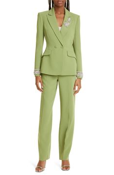 Sparkling rhinestones at the cuffs and lapels glamorize the traditionally polished silhouette of a double-breasted blazer rendered in a pastel-green hue. 28" length (size 8) Peaked lapels Lined 69% triacetate, 31% polyester Dry clean Imported Elegant Embellished Blazer With Lapel Collar, Elegant Embellished Evening Suits, Elegant Embellished Suits For Evening, Tailored Embellished Formal Suits, Fitted Embellished Blazer With Suit Collar, Tailored Embellished Suits For Work, Tailored Embellished Suits For Formal Occasions, Embellished Tailored Suits For Formal Occasions, Elegant Evening Blazer With Rhinestones