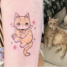 a cat sitting on the floor next to a tattoo