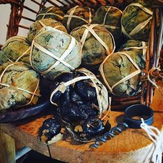 a basket filled with lots of different types of food on top of a wooden table