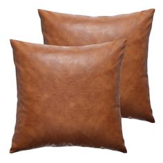 two brown leather pillows sitting on top of each other