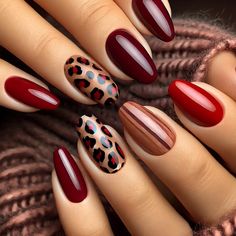 This bold design mixes ombre gradients of burgundy with animal print on a nude accent nail. It’s perfect for anyone looking to showcase their adventurous side in 2025.  Professional Tip: Use a makeup sponge for a smooth ombre effect and a detail brush for the animal print. Seal with a glossy top coat.  Best For: Autumn parties or Halloween-themed events.  Essentials to Recreate This Look:  Burgundy and nude polish Makeup sponge for blending Fine nail art brush for animal print Top coat for shine Burgundy And Leopard Nails, Winter Nails Burgundy, Fall Season Nails, Nails Burgundy, Burgundy Nail Designs, Leopard Nail Art, Season Nails, Natural Nail Designs, Chrome Nails Designs