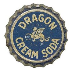 a bottle cap with the words dragon cream soda on it