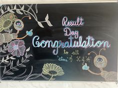 a chalk board with flowers and butterflies on it that says result day congratulations to all of us