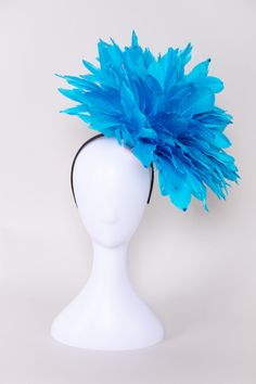 Get ready to party when you wear this fun and fluffy fascinator! Covered in solid bright red-colored feathers and accented with sequins. Pair this with a dress, jumpsuit, or romper for your next event! NO RETURNS/EXCHANGES due to the nature of the product (special occasions and headwear). Not all screens/lighting are created equal. Make sure you are happy with the color match before ordering! If you have any concerns, let us know! All Sales Final on Hats and Fascinators. Colors will vary with di Blue Headpieces For Spring Party, Blue Spring Party Headpieces, Party Headpieces With Ostrich Feather Trim, Fitted Party Headpiece With Ostrich Feathers, Blue Feathered Fascinator For Summer, Blue Feather Fascinator For Summer, Blue Feathered Summer Fascinator, Blue Feathered Fascinator For Races, Ostrich Feather Headpiece For Kentucky Derby Party