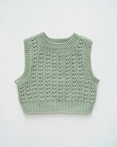 a green knitted sweater on a white background