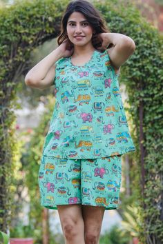 This pajama short set features a relaxed fit sleeveless tank with a round neckline and comfy drawstring elastic waist shorts with convenient pockets. Featuring a cute and colorful elephant print on a vibrant jade green background, this Pajama Short Set is made of 100% high quality woven Indian cotton and is perfect for all seasons, especially those Spring and Summer nights! This printed pajama set from Sevya Handmade is fair trade and machine washable. Available in combined sizes, S/M and L/XL. Comfortable Green Pajama Party Sets, Comfortable Green Sets For Pajama Party, Playful Loungewear Short Set, Casual Sleeveless Loungewear Sets, Casual Summer Pajama Party Sets, Green Short Sleepwear For Summer, Relaxed Fit Cotton Sleeveless Set, Playful Cotton Short Set For Loungewear, Playful Cotton Loungewear Short Set