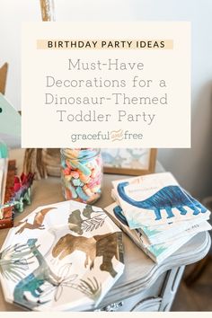 a birthday party table with dinosaur themed plates and napkins