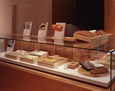 a display case filled with lots of different types of pastries