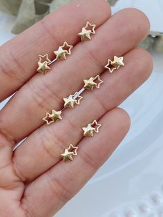 * A B O U T * O U R * S T U D S* 10K GOLD DOUBLE STAR STUD EARRINGS Our solid gold double-star earrings are the cutest way to show your celestial spirit! Tiny, dainty, and simple, they are great everyday earrings. They are hypoallergenic, lightweight, and perfect for sensitive ears. Perfect for any occasion, from casual to elegant.  * D E T A I L S * * 10K Gold * 10K Screw Backs * Dimension: 11mm x 5mm * Stone Shape: Star * Sold as a pair * Hypoallergenic ∙ ∙ ∙ ∙ ∙ ∙ ∙ ∙ ∙ ∙ ∙ ∙ ∙ ∙ ∙ ∙ ∙ ∙ ∙ ∙ ∙ ∙ ∙ ∙ ∙ ∙ ∙ ∙ ∙ * E T S Y * S H O P MORE SOLID GOLD EARRINGS: https://www.etsy.com/shop/livaurajewelry?ref=seller-platform-mcnav ∙ ∙ ∙ ∙ ∙ ∙ ∙ ∙ ∙ ∙ ∙ ∙ ∙ ∙ ∙ ∙ ∙ ∙ ∙ ∙ ∙ ∙ ∙ ∙ ∙ ∙ ∙ ∙ ∙ * S H I P P I N G * T I M E S FREE USA DELIVERY / INTERNATIONAL DELIVERY * USA Standard: 3 - 5 working days * U Celestial Star Piercings Gift, Celestial Star-shaped Piercings As Gift, Celestial Star-shaped Piercings For Gifts, Dainty Gold Star Cartilage Earrings, Tiny Gold Star Cartilage Earrings, Gold Dainty Star Cartilage Earrings, Gold Star-shaped Dainty Cartilage Earrings, Gold Star Cartilage Earrings Nickel Free, Gold Nickel-free Star Cartilage Earrings