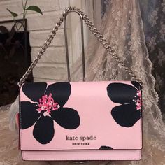 New With Tags Kate Spade Cameron Grand Flora Crossbody Bag Color-Pink With Black Flowers 5.8"H X 9.2"W X 2.6” Drop: 22" Material : Saffiao Two Way Spade Jacquard Lining Metal Pinmount Logo Flap And Magnetic Snap Closure Interior Back Slip Pockets Exterior Back Slip Pocket Pet-Free & Smoke-Free House Swag Bags, Kate Spade Heart, Pretty Purses, Bow Purse, Products Photography, Purse Essentials, Pocket Pet, Pinterest Ideas, Swag Bag