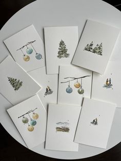 six cards with different designs on them sitting on a table