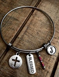 "Stainless steel adjustable Blessed bracelet can be made with a Hammered Rectangle charm or Circle Cut Out charm and your choice of a letter initial charm. These come in either 2.6\" large, 2.4\" average, or 2.0\" (child size). Stainless steel will not tarnish and will be durable for years to come. If you would like a different color of bead than in the pictures, please send a note with your purchase. **Please add a note with your choice of letter charm** INSTRUCTIONS: Please send the informatio Adjustable Charms Jewelry For Friendship, Adjustable Stainless Steel Beaded Bangle Bracelets, Adjustable Stainless Steel Beaded Bangle, Adjustable Stainless Steel Beaded Bracelet, Personalized Adjustable Metal Charm Bracelet, Adjustable Stainless Steel Charm Bracelet For Friendship, Adjustable Stainless Steel Friendship Charm Bracelet, Adjustable Chain Bangle As A Gift, Adjustable Hypoallergenic Charm Bangle Bracelet