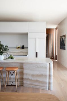 the kitchen is clean and ready to be used as a dining room or living room