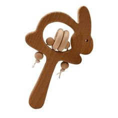 a wooden toy with a rabbit on it's back