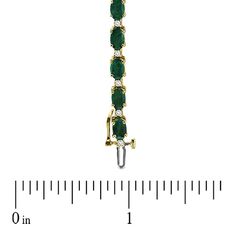 Dress her wrist in glamorous green emeralds and shimmering diamonds. Expertly crafted in warm 14K gold, this traditionally designed bracelet pairs 6.0 x 4.0mm oval-shaped verdant green emeralds with shimmering white diamonds to create a sparkling and colorful garland. An exceptional look, perfect with her most special attire, this bracelet captivates with 3/8 ct. t.w. of diamonds and a polished shine. The 7.0-inch bracelet secures with a durable box clasp. Elegant Emerald Tennis Bracelet For Formal Occasions, Formal Oval Gold Bracelet With Diamond Accents, Elegant May Birthstone Tennis Bracelet For Formal Occasions, Elegant May Birthstone Tennis Bracelet For Formal Events, Green Oval Bracelets For Anniversary, Elegant Formal May Birthstone Tennis Bracelet, Oval Gold Bracelet With Gemstone For Anniversary, Green Oval Diamond Bracelet For Anniversary, Oval Yellow Gold Bracelet With Prong Setting