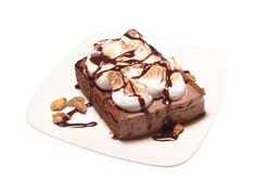 a piece of chocolate dessert with marshmallows on top